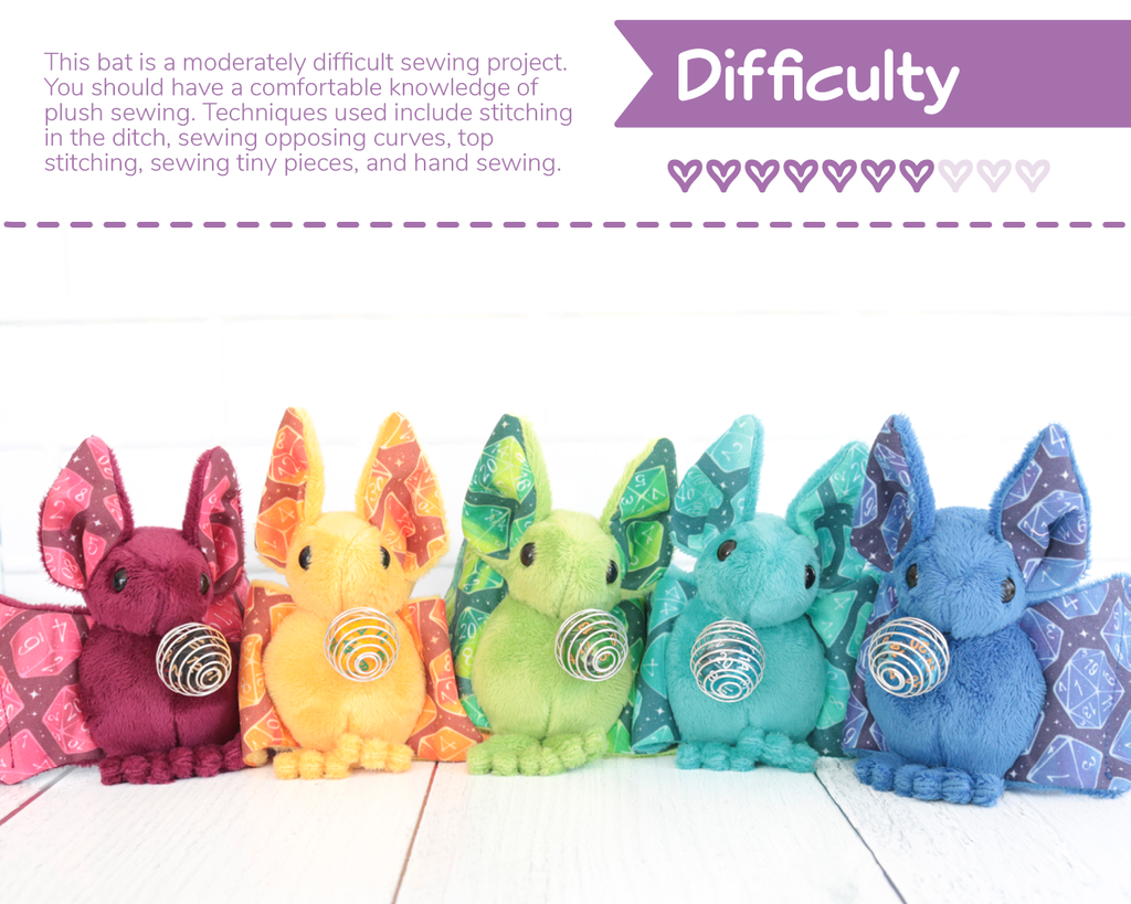On the top is a banner which reads "Difficulty" and has 7 out of 10 hearts dark purple. Text describes the difficulty level (the same as in the product description) and a photo of a rainbow group of bats are below it.